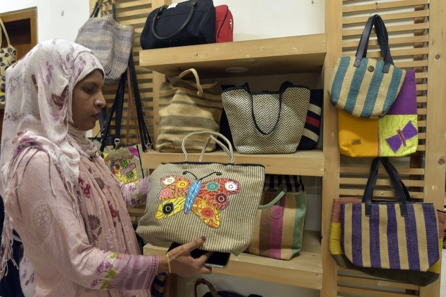 A visitor views a product made from jute fibers at the Jute Diversification Promotion Center in Dhaka, capital of Bangladesh, Sept. 26, 2022. (Xinhua)