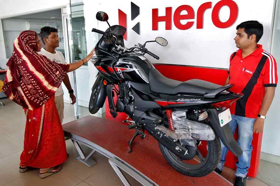 Customers looking at a Hero MotoCorp Karizma motorbike at a Hero MotoCorp showroom in the western Indian city of Ahmedabad –Reuters file photo