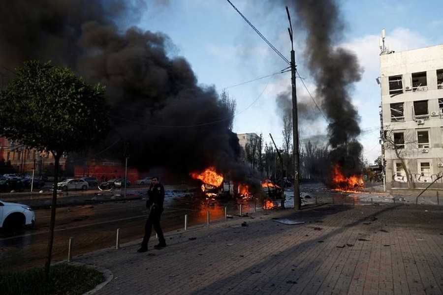 Cars are seen on fire after Russian missile strikes, as Russia's attack continues, in Kyiv, Ukraine October 10, 2022. REUTERS