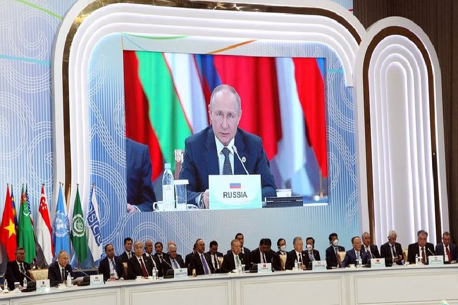 Russian President Vladimir Putin is seen on a screen during the 6th summit of the Conference on Interaction and Confidence-building Measures in Asia (CICA), in Astana, Kazakhstan Oct 13, 2022. Sputnik/Konstantin Zavrazhin/Pool via REUTERS