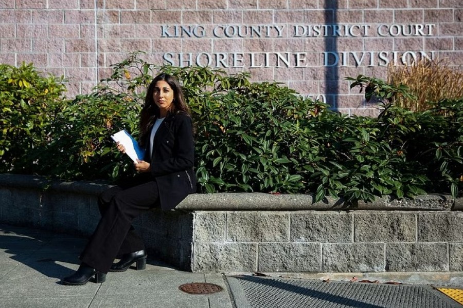 Licensed esthetician Simran Bal, who was taken to court by her former employer to repay $1900 in trainings they required her to attend, poses for a portrait outside the King County District Court in Shoreline, Washington, US, October 13, 2022. Bal, whose case was dismissed, says she was already licensed for services the trainings covered. REUTERS