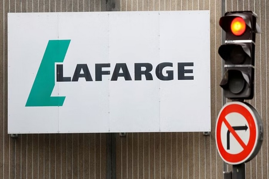 The logo of French concrete maker Lafarge is seen on the plant of Bercy on the banks of the river Seine in Paris, France, September 3, 2020.REUTERS/Charles Platiau