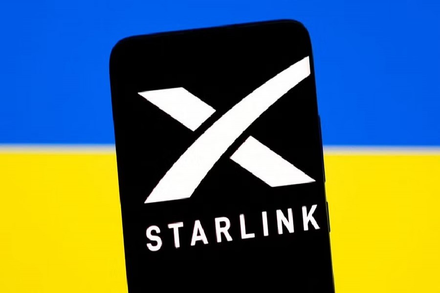 Starlink logo is seen on a smartphone in front of displayed Ukrainian flag in this illustration taken Feb 27, 2022. REUTERS