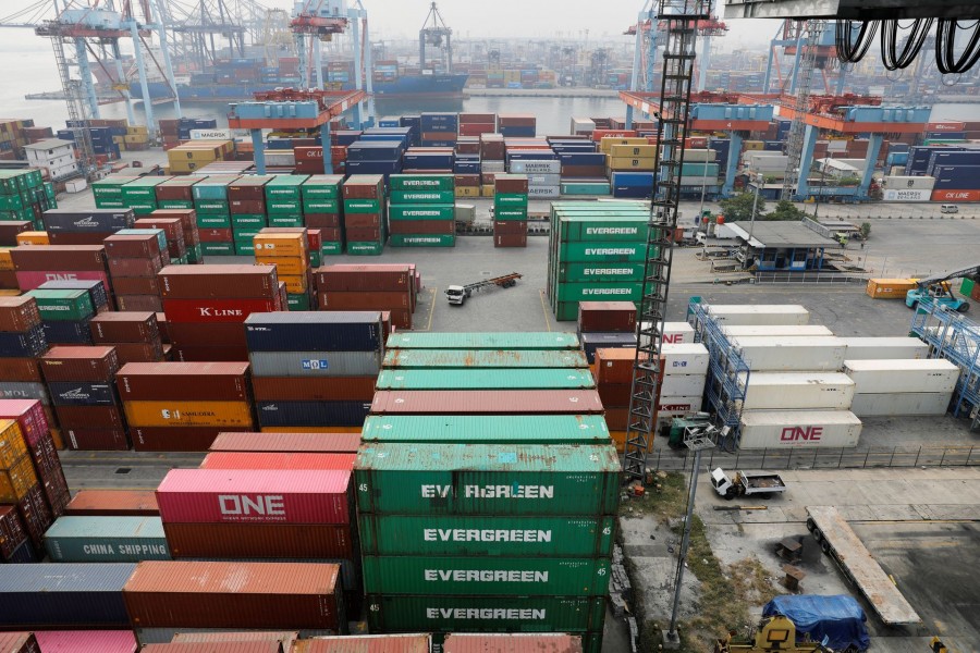 A truck drives past stacks of container at the Tanjung Priok port in Jakarta, Indonesia on August 3, 2022 — Reuters/Files