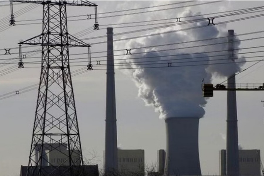 FILE PHOTO: A coal-fired power plant is pictured near a construction site in Beijing, China, Dec 9, 2016. REUTERS