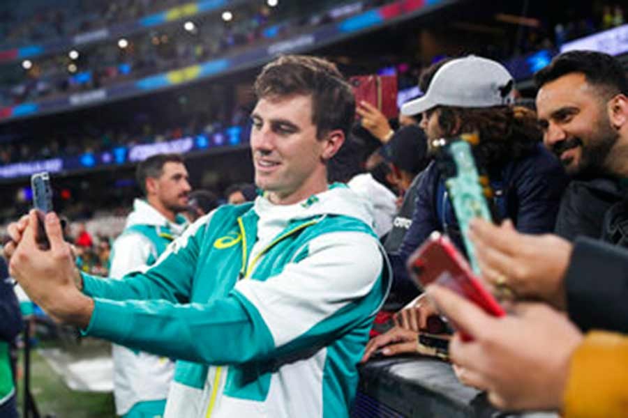 Australia's Pat Cummins posing for a selfie with fans after their T20 World Cup cricket match against England was abandoned due to rain in Melbourne on Friday –AP photo