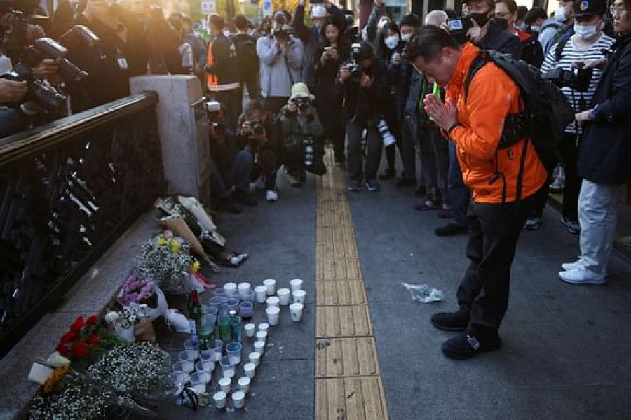 A man pays tribute near the scene of the stampede during Halloween festivities, in Seoul, South Korea, October 30, 2022. Reuters