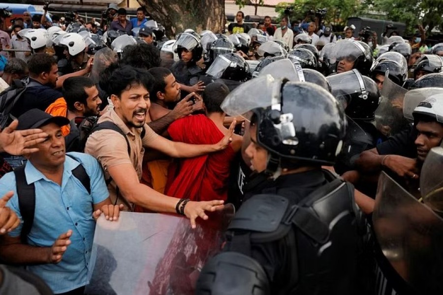 Demonstrators shout at Sri Lankan police officers during an anti-government protest by trade unions, student movements, and civil organisations, including the main opposition parties, amid the country's economic crisis, in Colombo, Sri Lanka, Nov 2, 2022. REUTERS