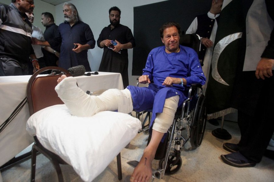 Former Pakistan's Prime Minister Imran Khan sits in a wheelchair after he was wounded following a shooting incident on a long march in Wazirabad, at the Shaukat Khanum Memorial Cancer Hospital & Research Centre in Lahore, Pakistan on November 4, 2022 — Reuters photo