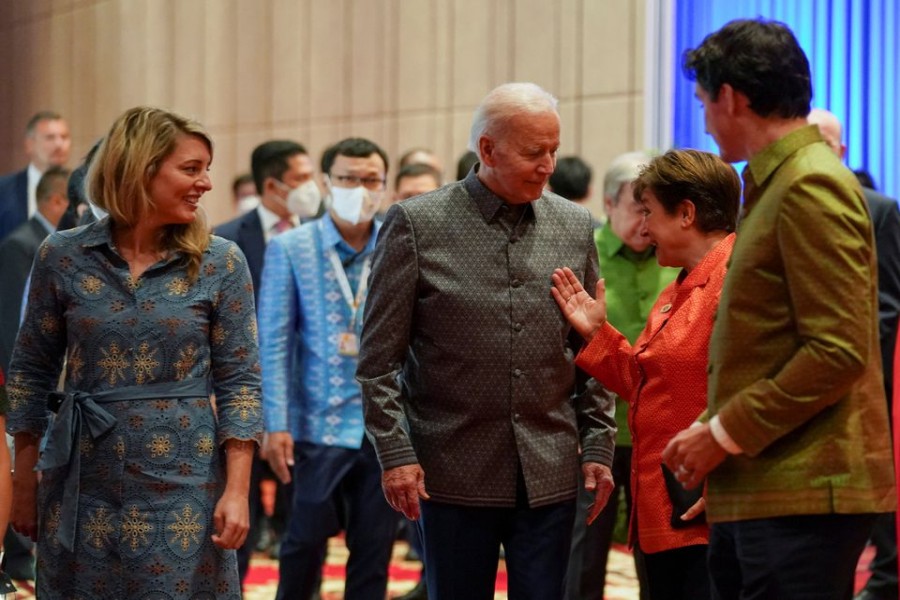 US President Joe Biden speaks with Kristalina Georgieva, Managing Director of the International Monetary Fund, next to Canada's Prime Minister Justin Trudeau and Canada's Foreign Minister Mealanie Joly as they attend a Gala Dinner, during the ASEAN summit, in Phnom Penh, Cambodia, November 12, 2022. REUTERS/Kevin Lamarque