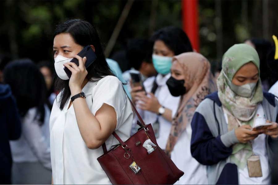 People gathering as they are evacuated outside a building following an earthquake in Jakarta on Monday –Reuters photo