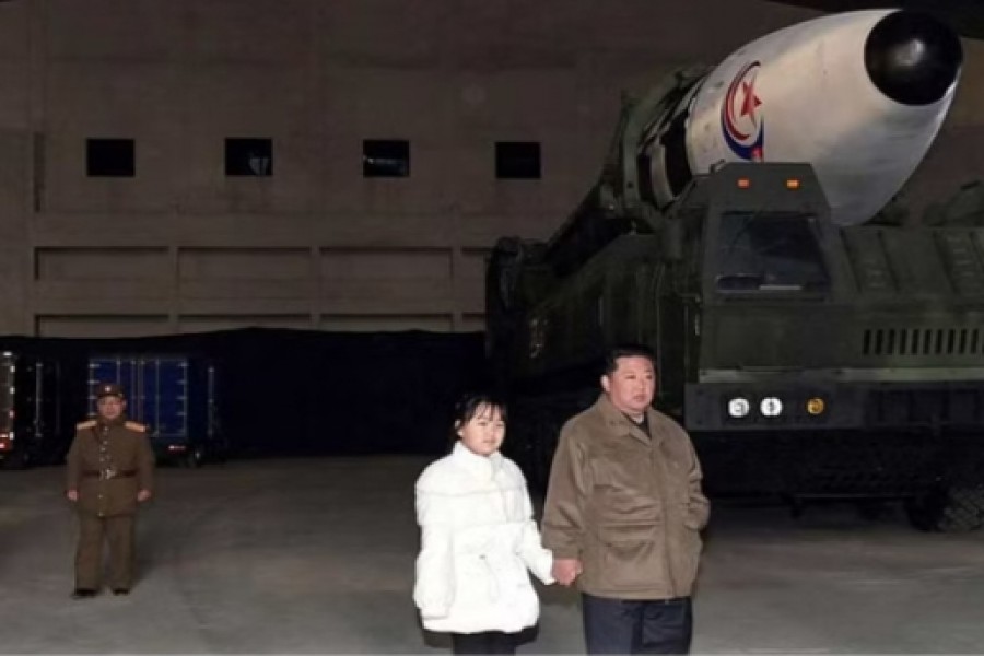 North Korean leader Kim Jong Un, along with his daughter, inspects an intercontinental ballistic missile (ICBM) in this undated photo released on November 19, 2022 by North Korea's Korean Central News Agency (KCNA). KCNA via REUTERS