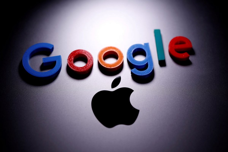 A 3D printed Google logo is placed on the Apple Macbook in this illustration taken April 12, 2020. REUTERS/Dado Ruvic/Illustration/File Photo