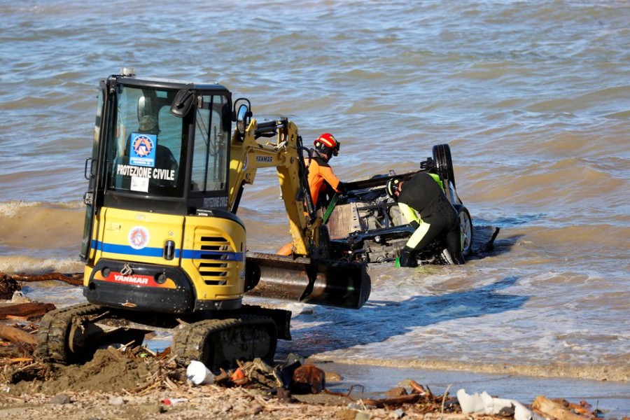 Rescue team members remove a car from the water following a landslide on the Italian holiday island of Ischia, Italy on November 27, 2022 — Reuters photo