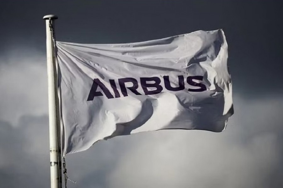 The logo of Airbus is pictured on a flag at the entrance of the Airbus facility in Bouguenais near Nantes, France, Nov 14, 2022. REUTERS