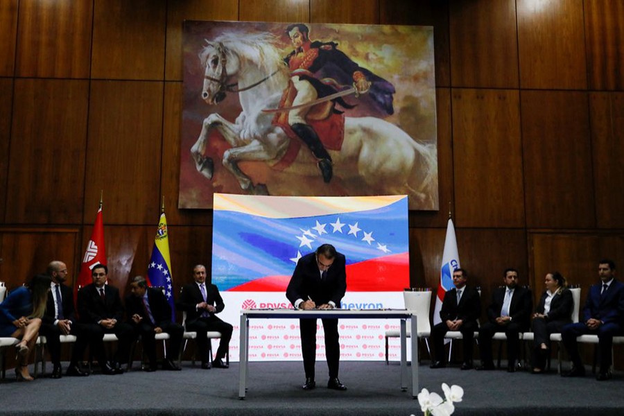 Boards outside PDVSA headquarters are pictured, during a news conference on the Chevron deal in Caracas, Venezuela on December 2, 2022 — Reuters photo