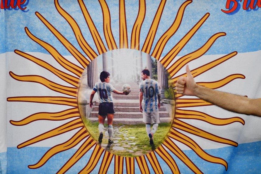 A flag with a picture of Argentina's Diego Maradona and Lionel Messi  — Reuters/Files