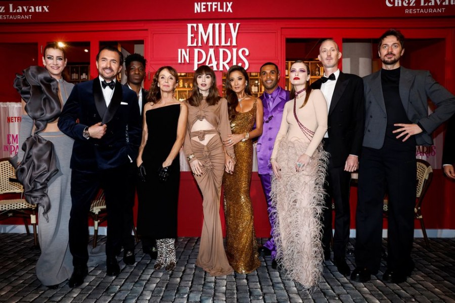 Kate Walsh, William Abadie, Philippine Leroy-Beaulieu, Samuel Arnold, Lily Collins, Ashley Park, Lucien Laviscount, Camille Razat, Bruno Gouery and Lucas Bravo attend the world premiere of the third season of the Netflix series "Emily in Paris" at the Theatre des Champs Elysees in Paris, France, December 6, 2022. REUTERS/Benoit Tessier