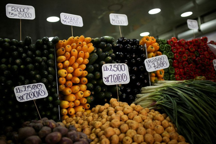 Signs with prices of different fruits and vegetables are seen in the Paloquemao market square, amid inflation reaching the highest figures in years, in Bogota, Colombia on October 7, 2022 — Reuters/Files