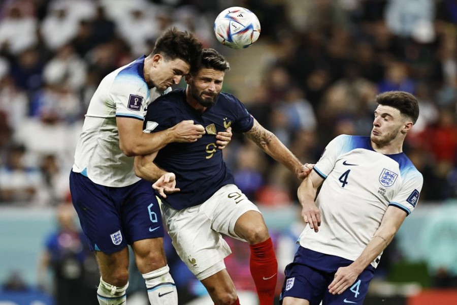 FIFA World Cup Qatar 2022 - Quarter Final - England v France - Al Bayt Stadium, Al Khor, Qatar - December 10, 2022 England's Harry Maguire in action with France's Olivier Giroud REUTERS/Hamad I Mohammed