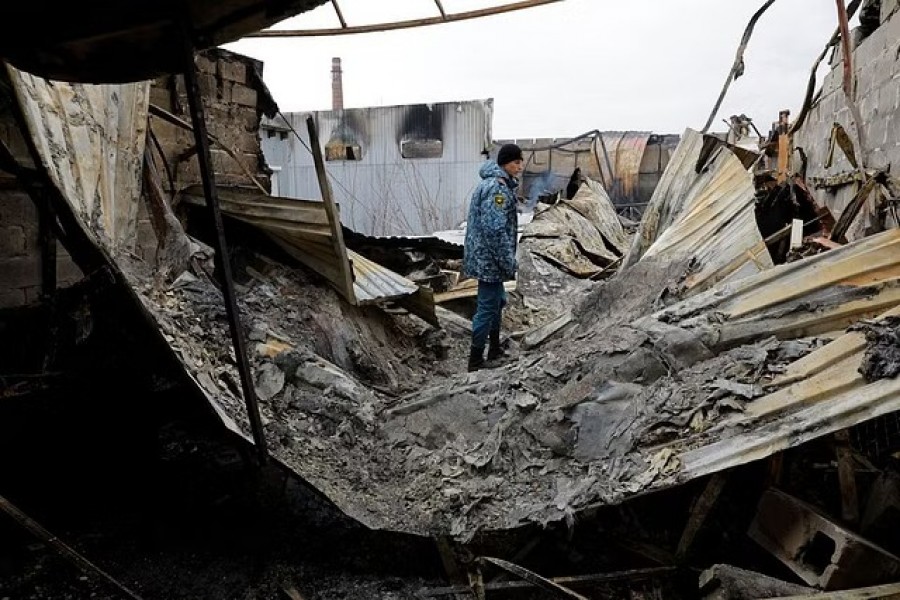 An emergencies ministry member walks at a local market hit by shelling in the course of Russia-Ukraine conflict in Donetsk, Russian-controlled Ukraine, December 12, 2022. REUTERS