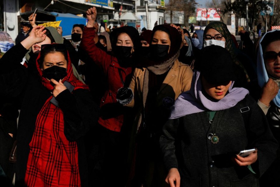 Afghan women chant slogans in protest against the closure of universities to women by the Taliban in Kabul, Afghanistan, December 22, 2022. REUTERS/Stringer