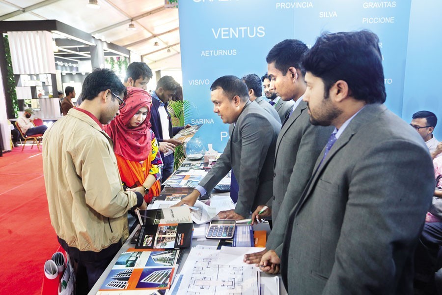 Visitors inquire about flats and apartments at the REHAB Housing Fair-2022 that concluded at the Bangabandhu International Conference Centre (BICC) in the city's Sher-e-Bangla Nagar area on Sunday