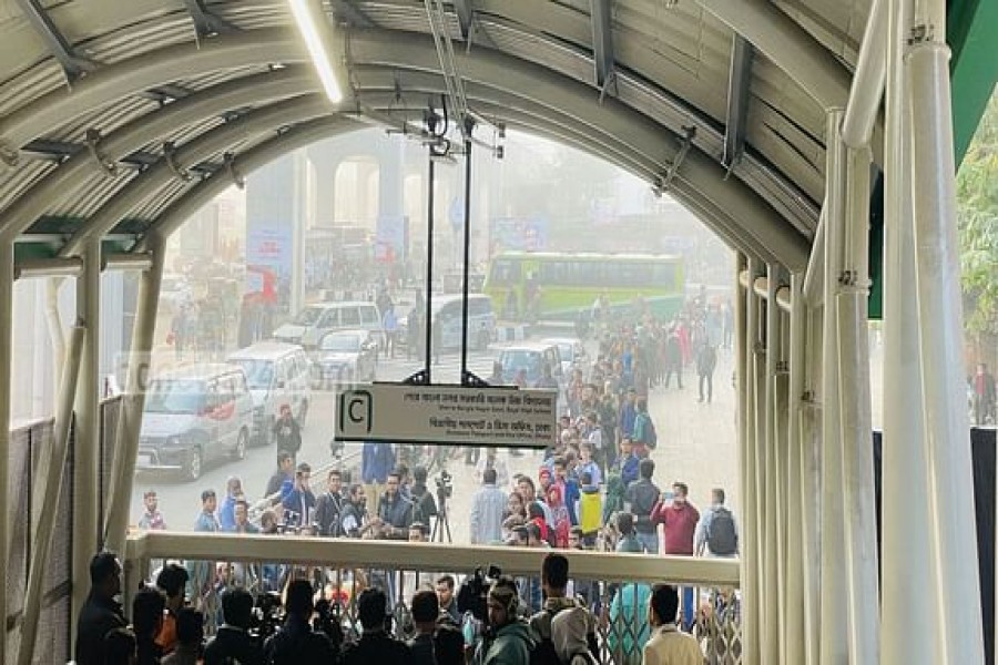 Passengers gather at Dhaka metro stations at first light