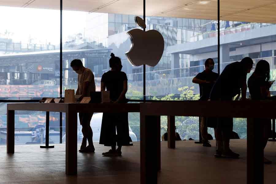 People looking at Apple products on September 16 last year as Apple Inc's new iPhone 14 models go on sale in Beijing –Reuters file photo