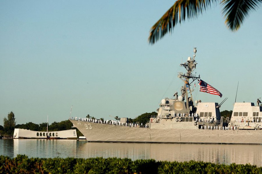 The USS Chung-Hoon passes the USS Arizona Memorial during ceremonies honouring the 73rd anniversary of the attack on Pearl Harbor at the World War II Valor in the Pacific National Monument in Honolulu, Hawaii on December 7, 2014 — Reuters/Files