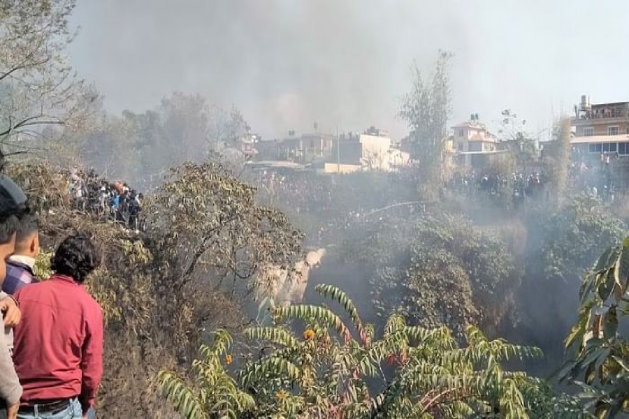 Crowd gather at the crash site of an aircraft carrying 72 people in Pokhara in western Nepal January 15, 2023. Sagar Raj Timilsina via REUTERS