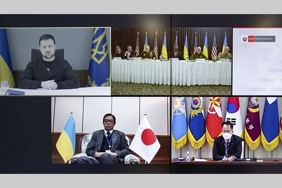 A screen shows Ukraine's President Volodymyr Zelenskiy speaking via video link with, among others, Ukraine's Defense Minister Oleksiy Reznikov, US Secretary of Defense Lloyd Austin, US Chairman of the Joint Chiefs of Staff Gen. Mark A. Milley and German Defence Minister Boris Pistorius during a meeting of ministers of defence to discuss how to help Ukraine defend itself, at Ramstein Air Base inGermany, amid Russia's attack on Ukraine continues, in Kyiv, Ukraine January 20, 2023.Ukrainian Presidential Press Service/Handout via REUTERS