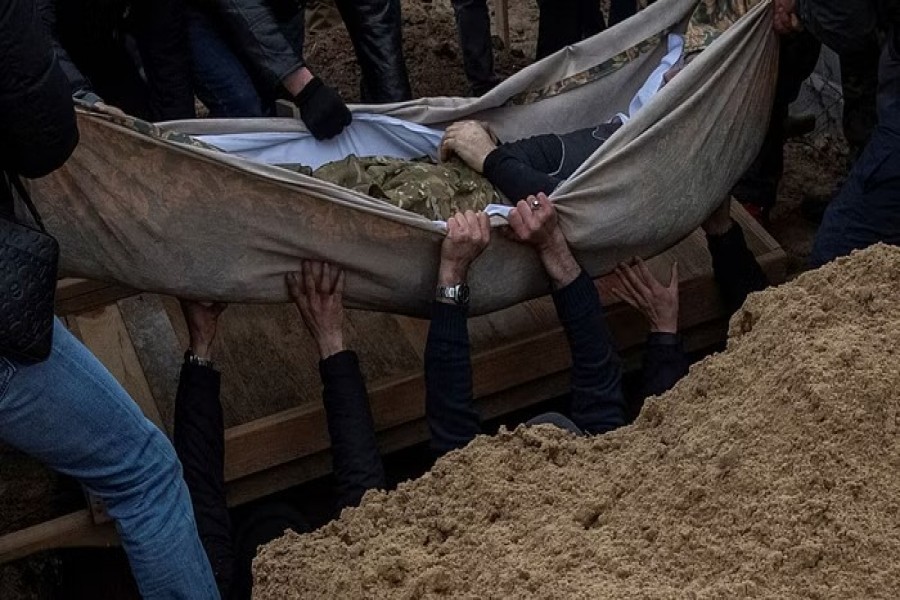 People take part in a funeral ceremony for Seyran Kadyrov, a Ukrainian serviceman of "Krym" (the Crimea) special unit, who was recently killed in a fight against Russian troops, amid Russia's attack on Ukraine, near Kyiv, Ukraine January 22, 2023. REUTERS/Alina Yarysh