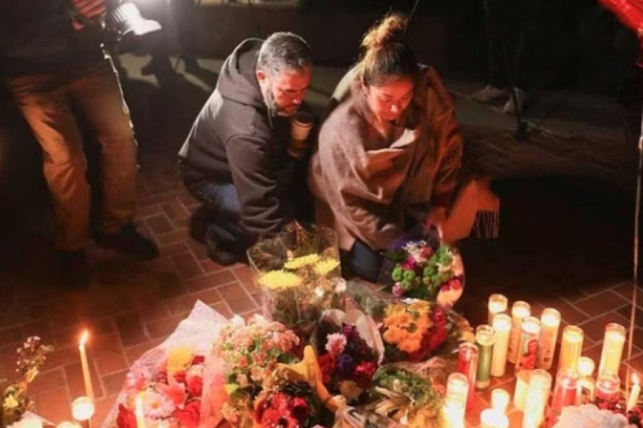 People gather for a candle light vigil after a mass shooting during Chinese Lunar New Year celebrations in Monterey Park, California, US January 23, 2023. Reuters