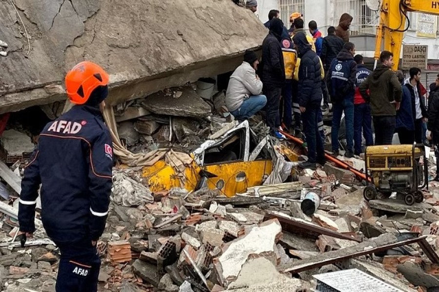 People search through rubble following an earthquake in Diyarbakir, Turkey, February 6, 2023. REUTERS