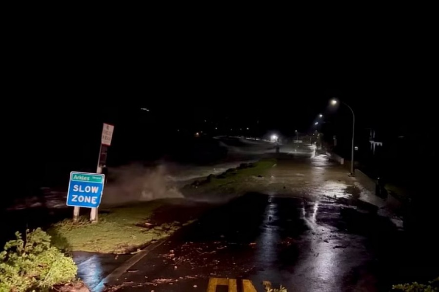 A view shows high tides rising due to Cyclone Gabrielle in Arkles Bay, Auckland, New Zealand February 13, 2023 in this screen grab obtained from a social media video. John Longson/Twitter @JohnLongson/via REUTERS