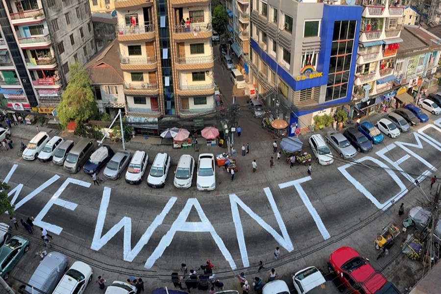 A slogan is written on a street as a protest after the coup in Yangon, Myanmar on February 21, 2021 — Reuters/Files