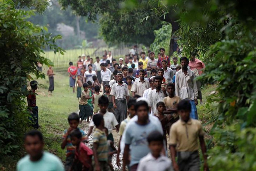 Men walk at a Rohingya village outside Maugndaw in Rakhine state, Myanmar on October 27 last. - Reuters file photo