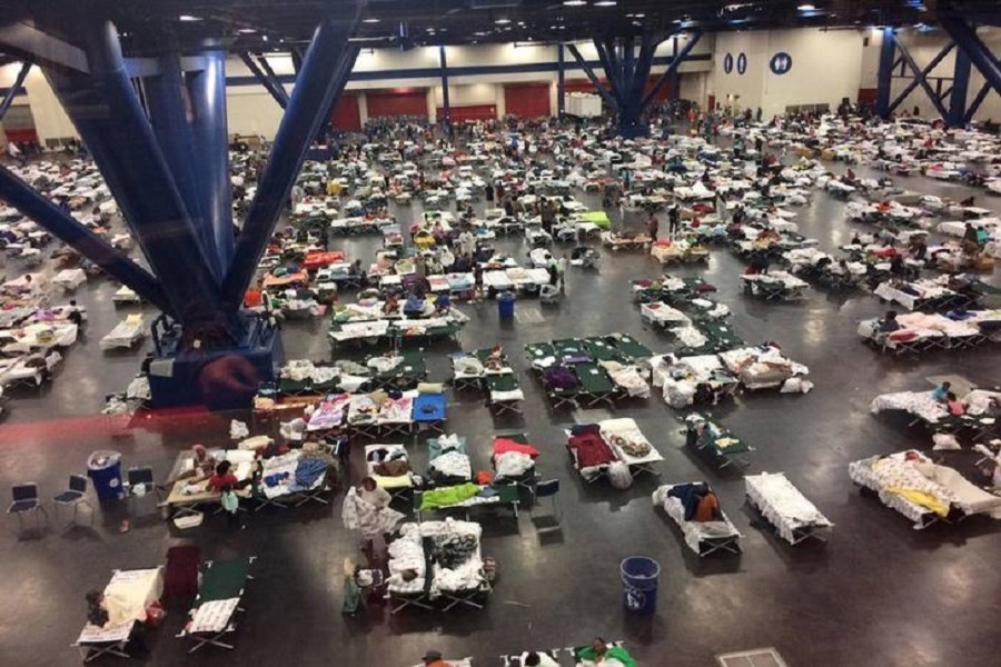 Evacuees take shelter from Tropical Storm Harvey in the George R. Brown Convention Center in Houston, Texas, US in this August 28, 2017 handout photo. Texas Military Department/Handout via Reuters