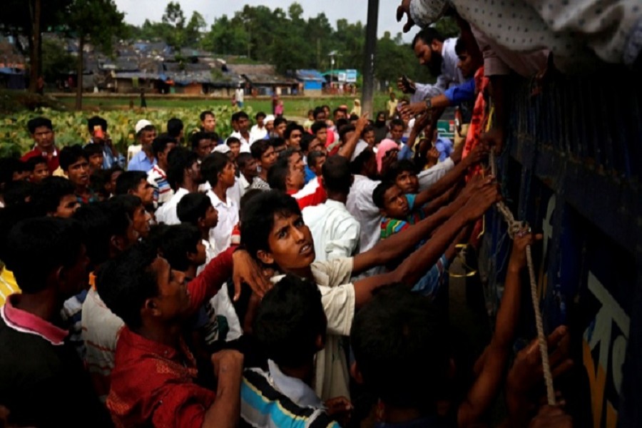 Rohingya refugees gather as they expect relief supplies in Kutupalang near Cox's Bazar. Reuters