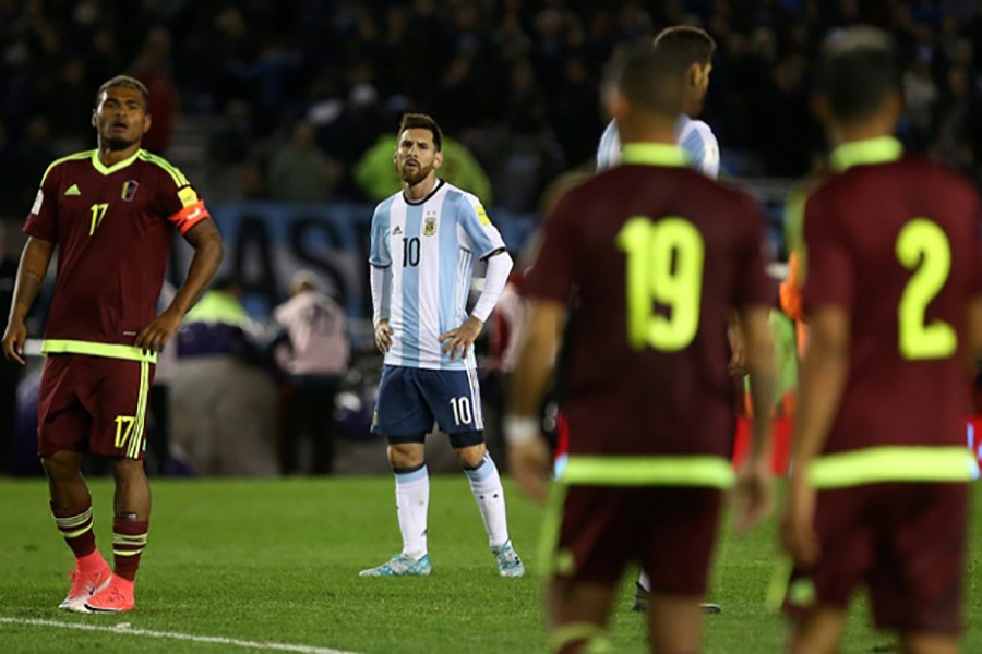 Lionel Messi cuts a dejected figure as Argentina couldn't get past lowly Venezuela at home. - Reuters photo