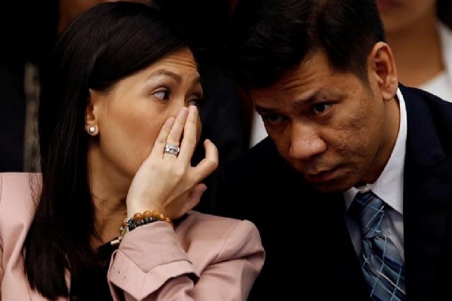 Maia Santos Deguito, a branch manager of the RCBC whispers to her lawyer during a Senate hearing on Bangladesh Bank cyber heist in Manila April 12, 2016. Reuters/ File Photo