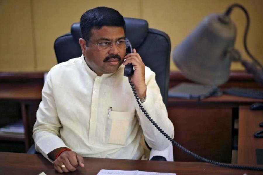 India's Oil Minister Dharmendra Pradhan speaks on phone during an interview with Reuters in New Delhi, India, May 5, 2016. Reuters/ Files