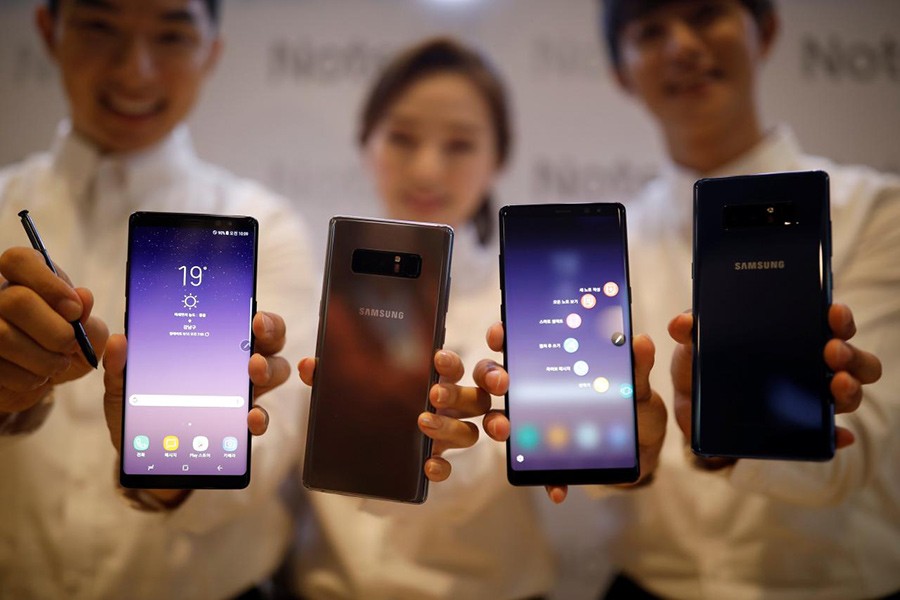 Models pose for photographs with Samsung Electronics' Galaxy Note 8 during its launching ceremony in Seoul, South Korea on Tuesday. - Reuters