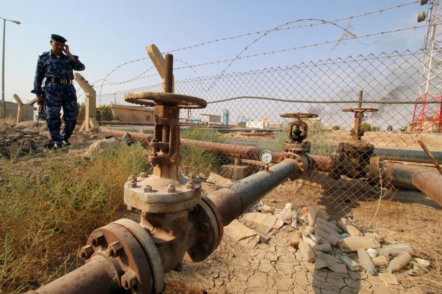 A member from the Oil Police Force is seen at Nahran Umran field norh of Basra, Iraq. 	— Reuters