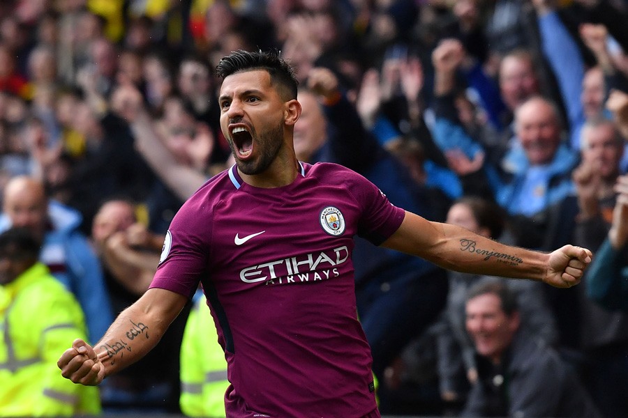 Manchester City's Argentinian striker Sergio Aguero celebrates scoring his third and the team's fifth goal against Watford on Saturday.	— Reuters