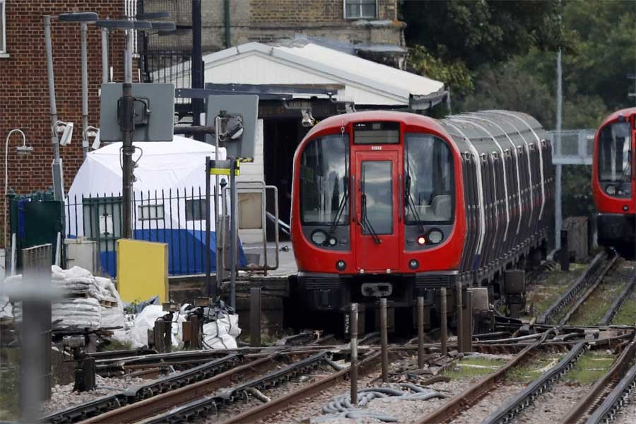 A police forensic tent stands setup on the platform next to the train on which a homemade bomb exploded at Parsons Green subway station in London (AP)