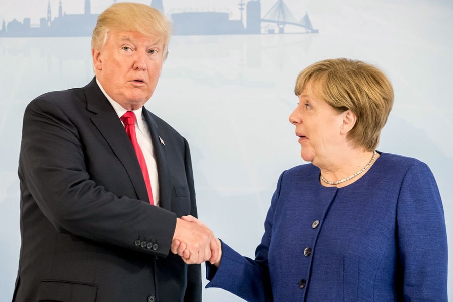 Donald Trump and Angela Merkel. The US’s inward turn leaves the world order without a main conductor.  - Reuters
