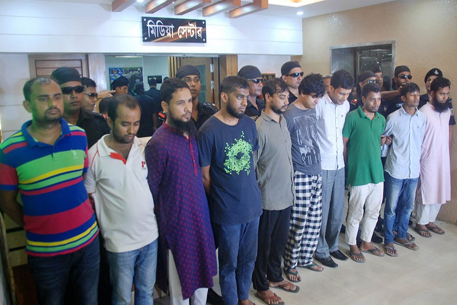 The RAB team also seized laptops, mobile phones, and documents from their possession. - Focus Bangla photo