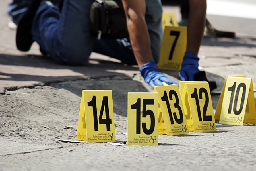 A police officer places police markers next to bullet cases at a crime scene in Mexico. Reuters file photo used for representation.